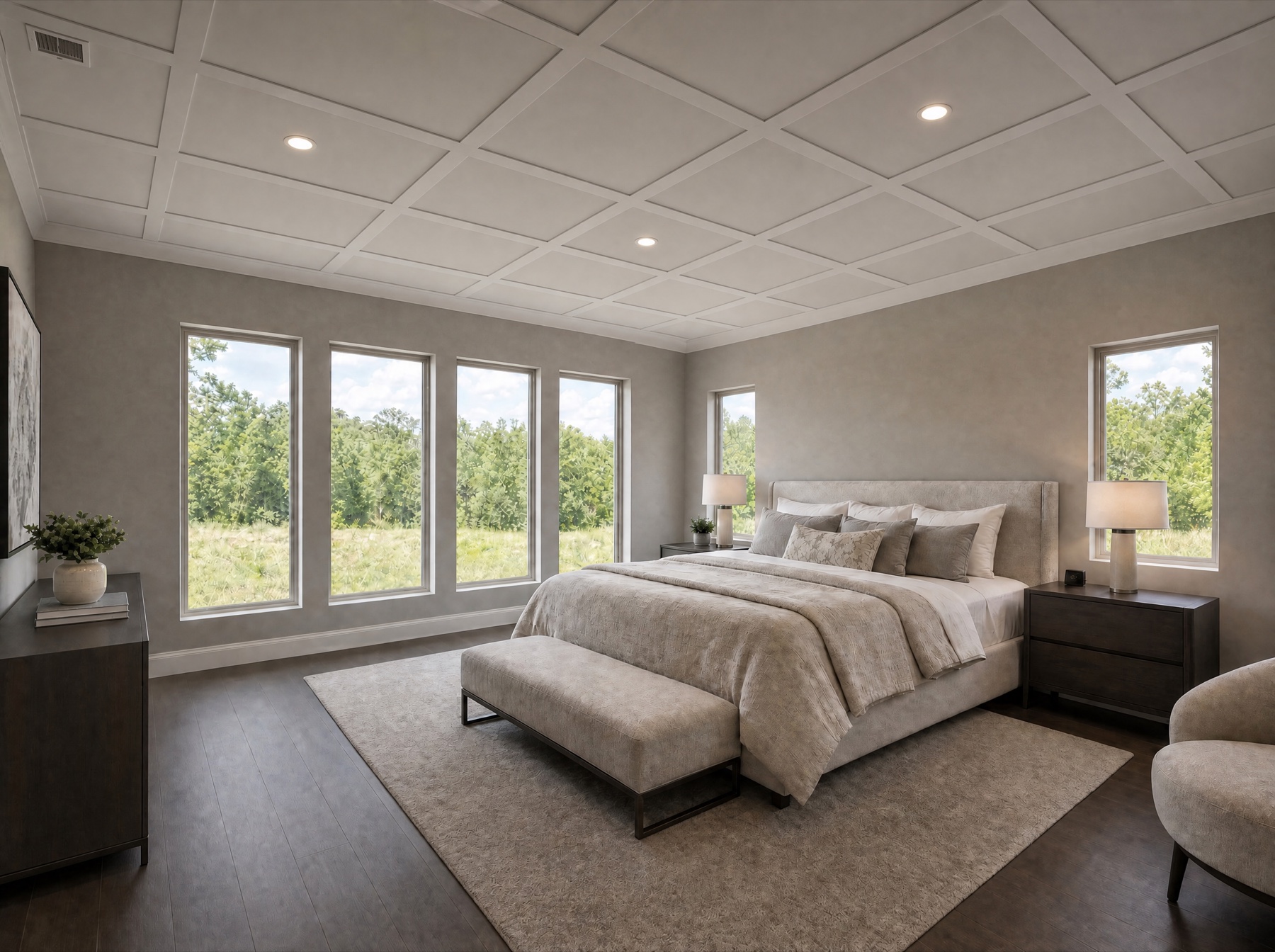 Primary bedroom suite with coffered ceiling and large windows